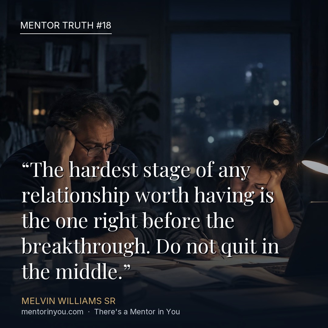 Mentor Truth 18: two exhausted colleagues working through paperwork late at night at a lamp-lit table, over the quote “The hardest stage of any relationship worth having is the one right before the breakthrough. Do not quit in the middle.” — Melvin Williams Sr